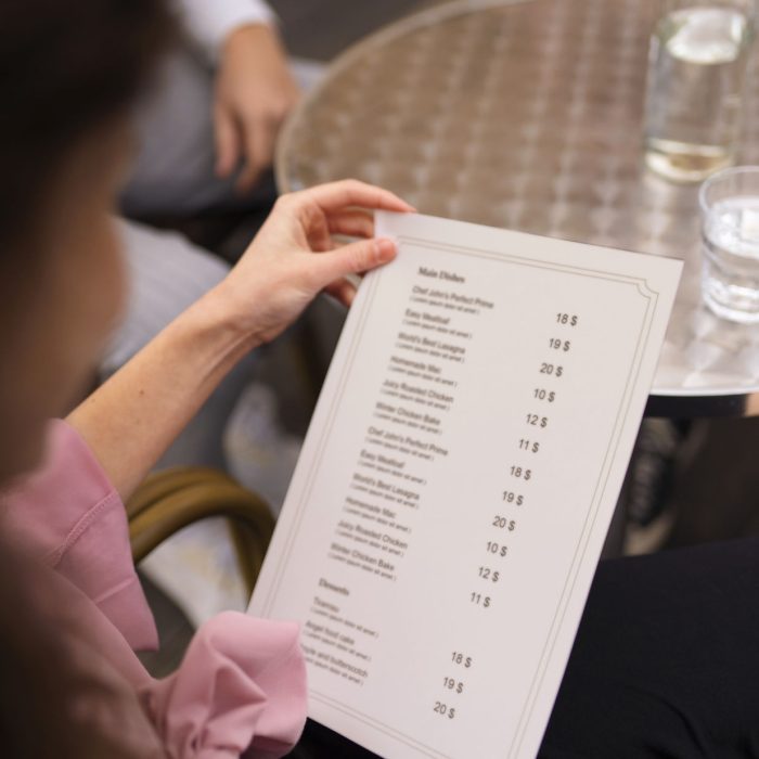high-angle-woman-holding-menu